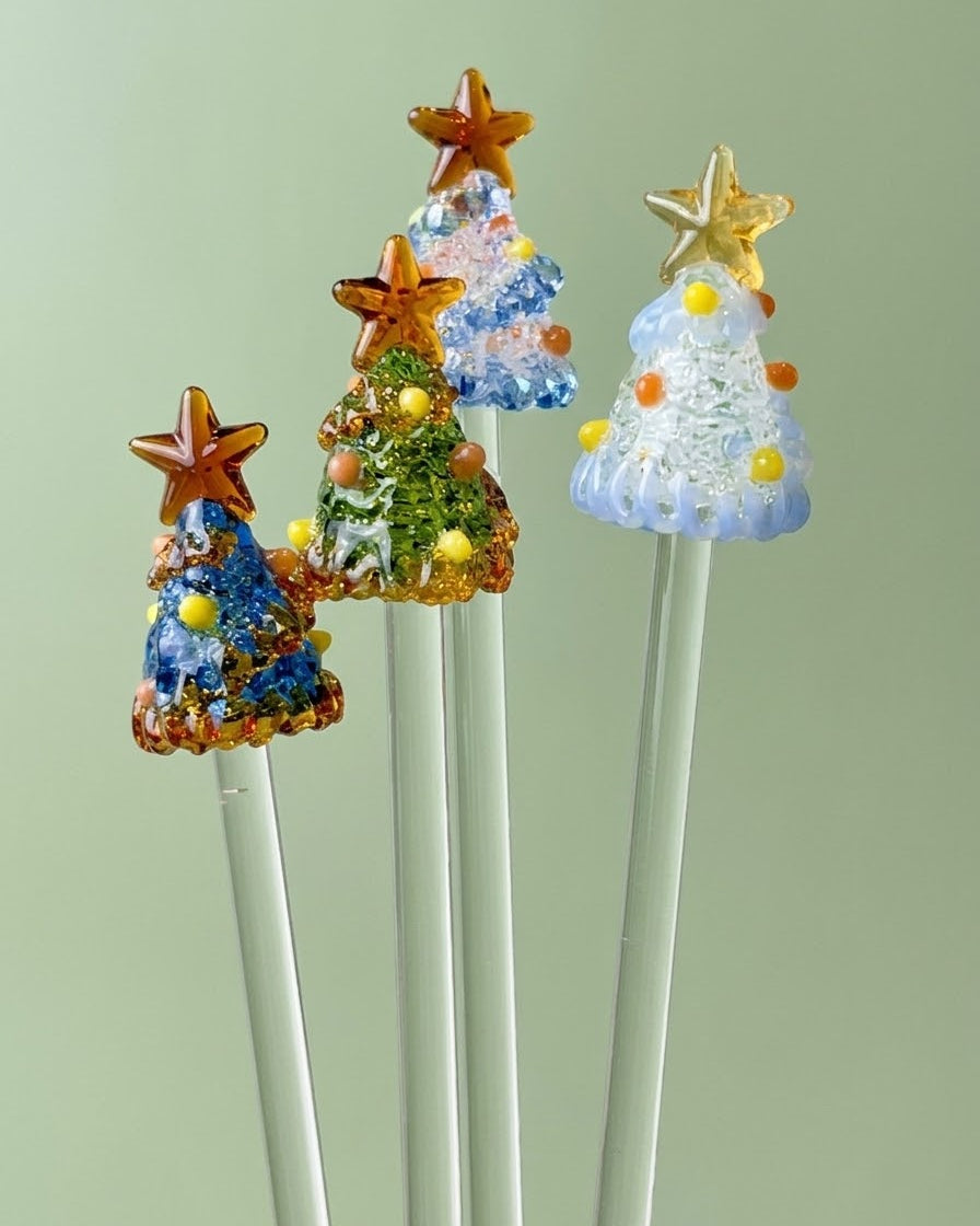 Hand-blown lampwork glass Christmas tree stirrer blind box collection by Ambero Oasis, featuring various festive colors.
