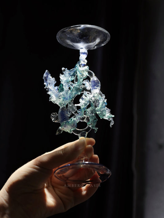 Pisces glass candle holder from the 12 Zodiac Signs Series by Ambero Oasis, featuring an intricate clear glass stem with flowing, water-like sculpted details.