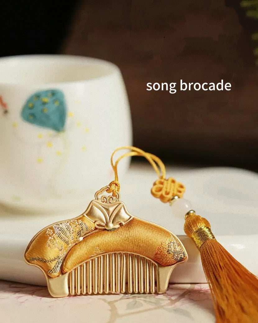 Gold Song Brocade traditional comb with a yellow tassel, one of the surprise items in the Intangible Heritage Mystery Box by Ambero Oasis.