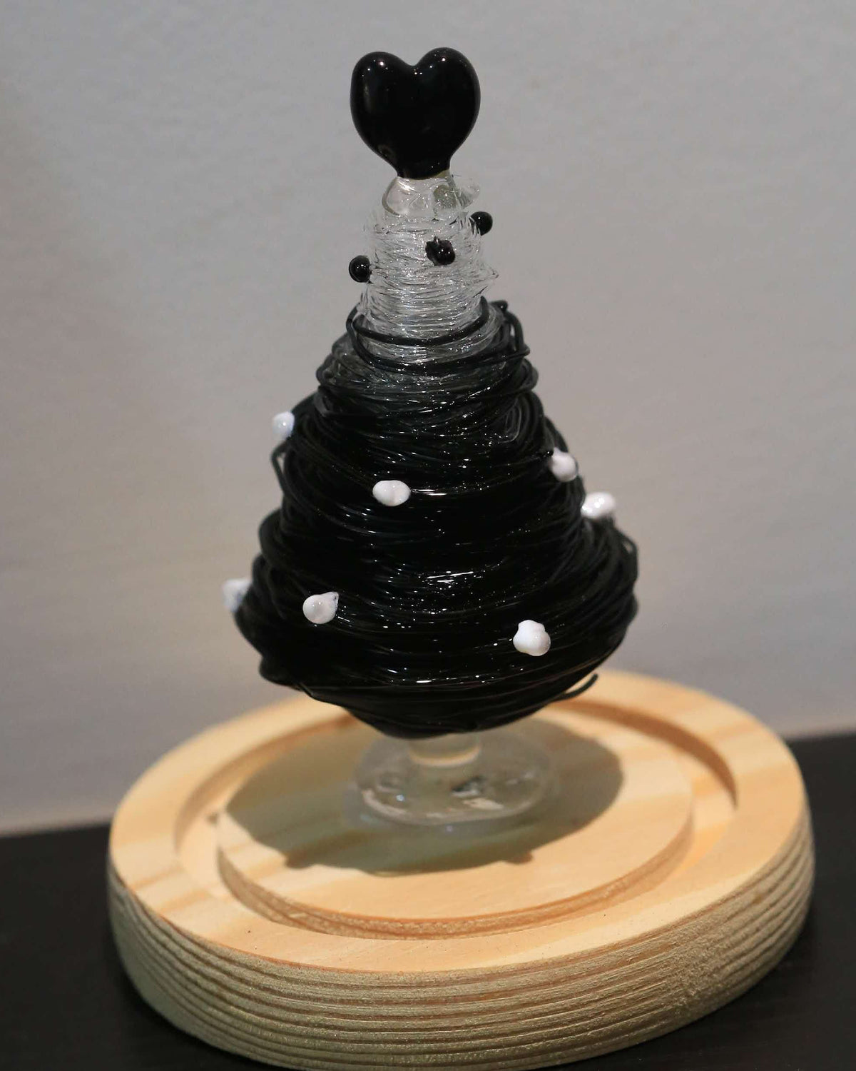 Dark gothic glass tree figurine on wood base for table decoration