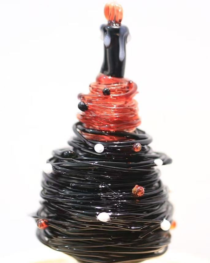 Black and red gradient glass Christmas tree with candle topper and wooden base