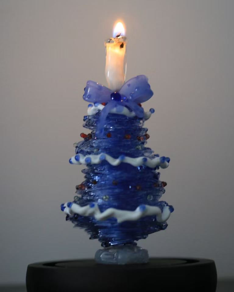Blue gradient glass Christmas tree with candle topper and black base