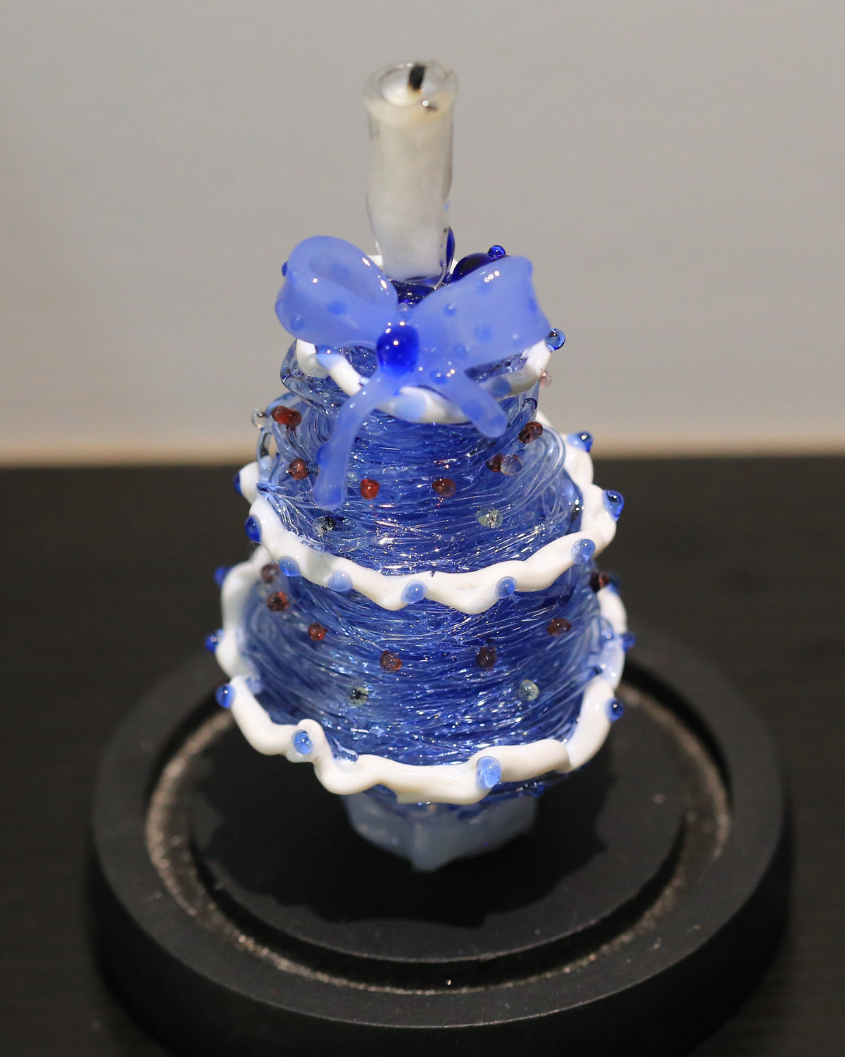 Blue gradient glass Christmas tree with candle topper and black base
