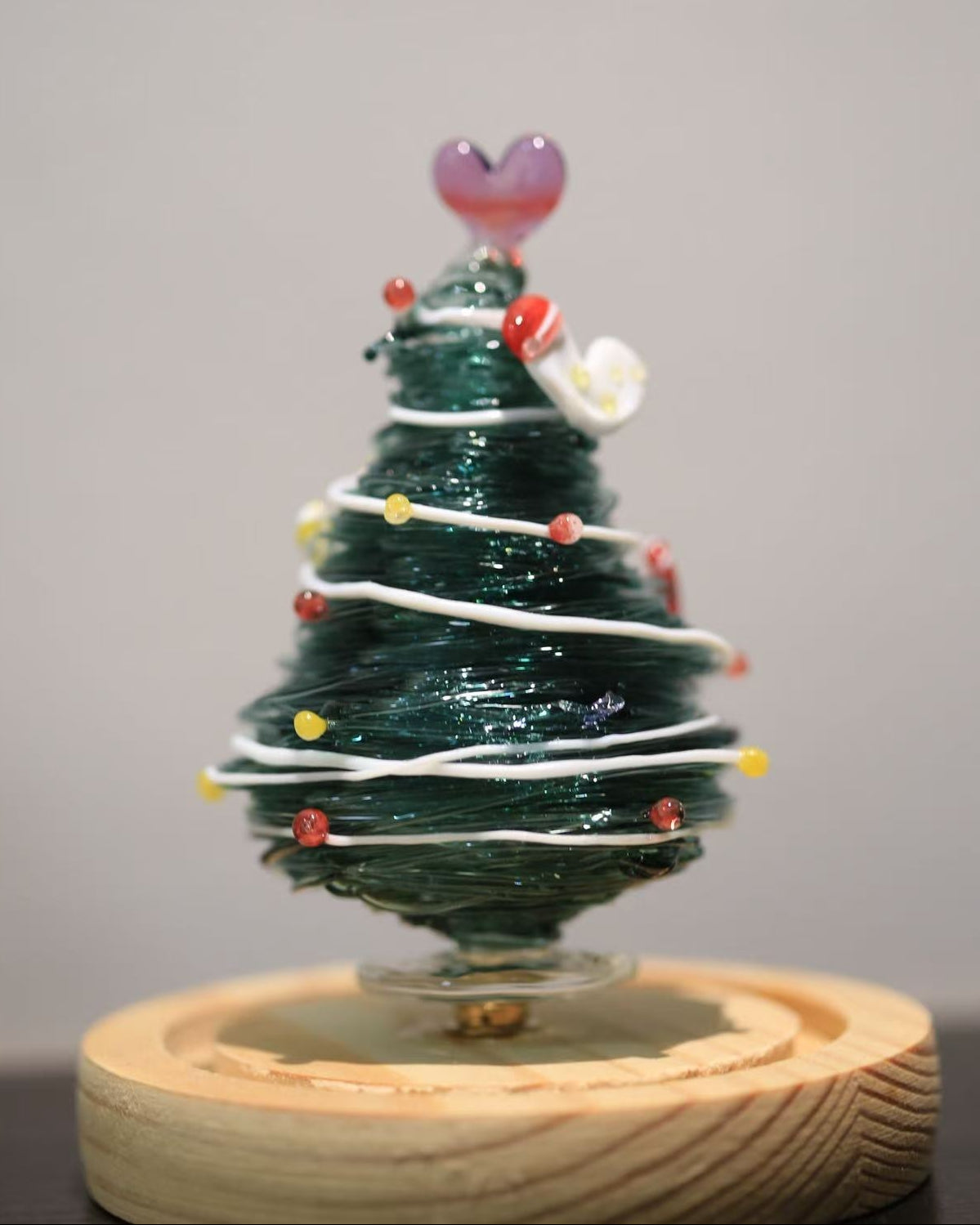 Green gradient glass Christmas tree with heart topper and wooden base