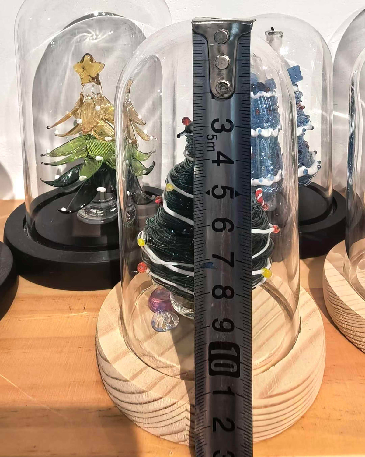 Green glass Christmas tree with glass dome and wooden base, 13cm total height
