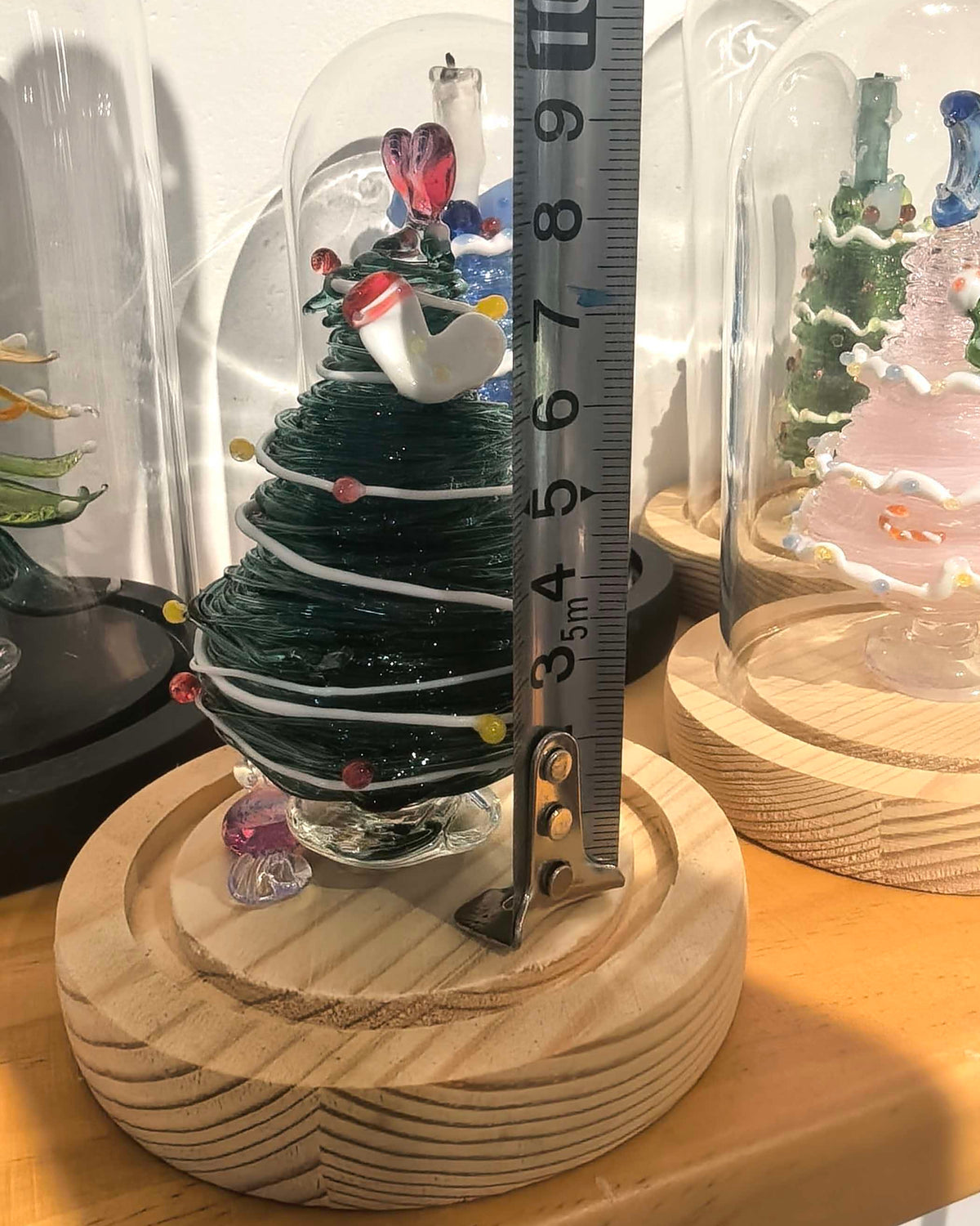 Green glass Christmas tree with glass dome and wooden base, 13cm total height