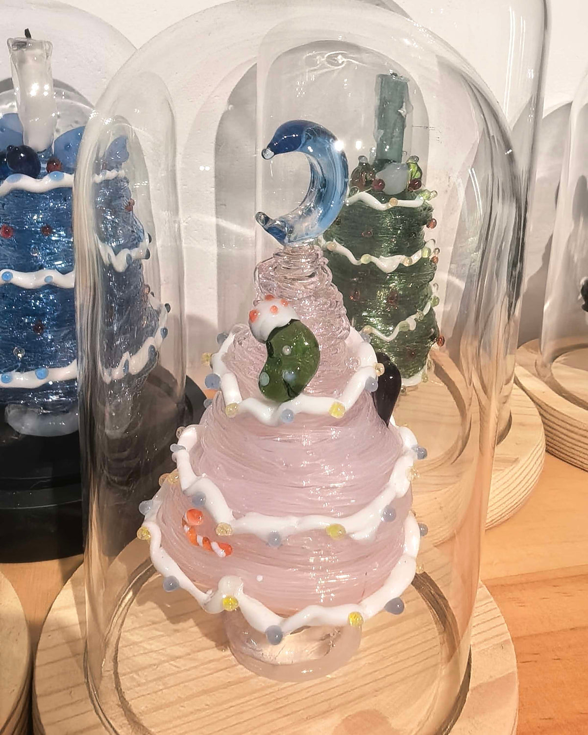 Pink glass tree centerpiece with moon and stars on wood base